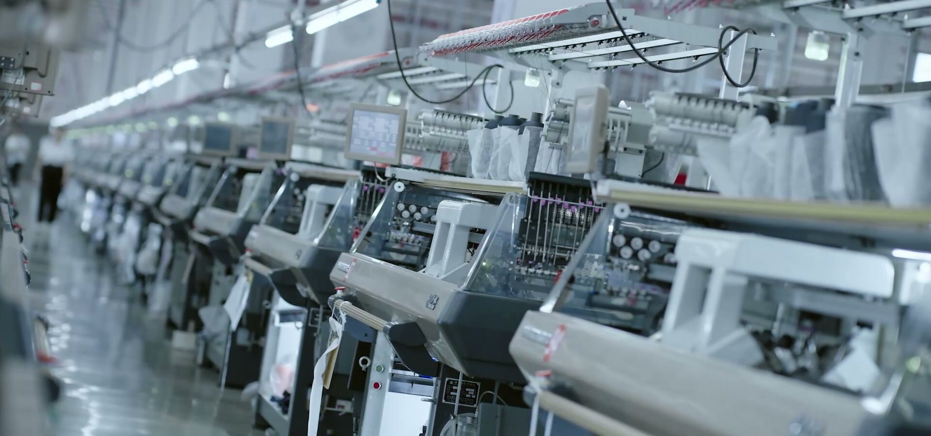 Rows of computerised stitching machines running inside the partner factory