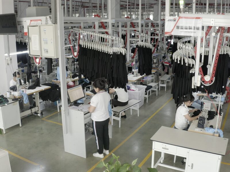 Rows of stitching stations along the production hall