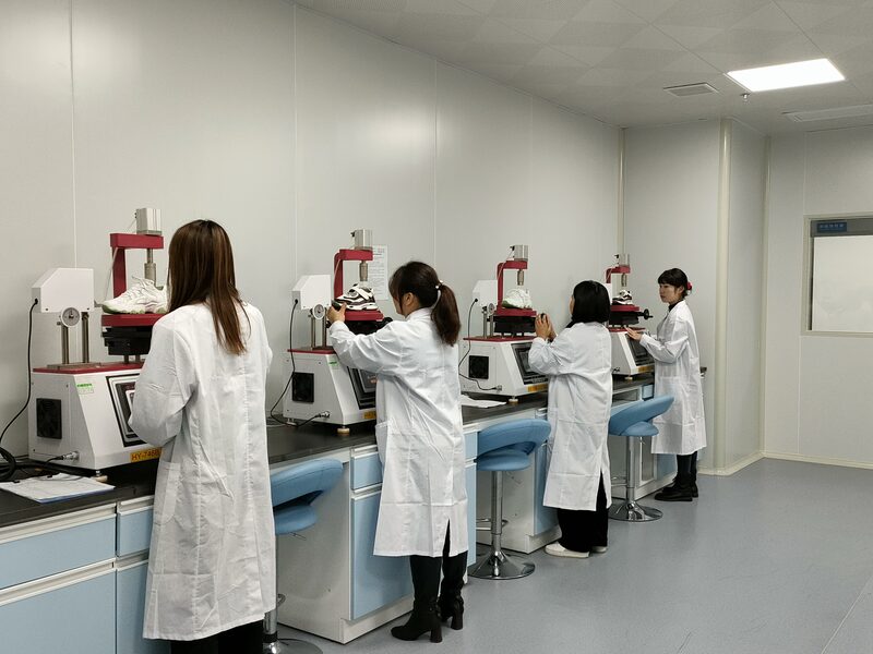 Quality control technicians working in the testing laboratory