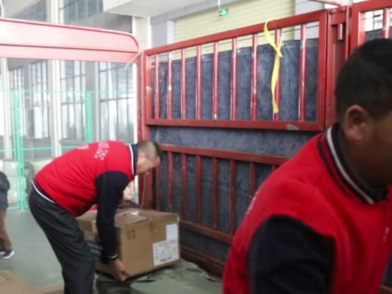 Warehouse staff sorting cartons for dispatch