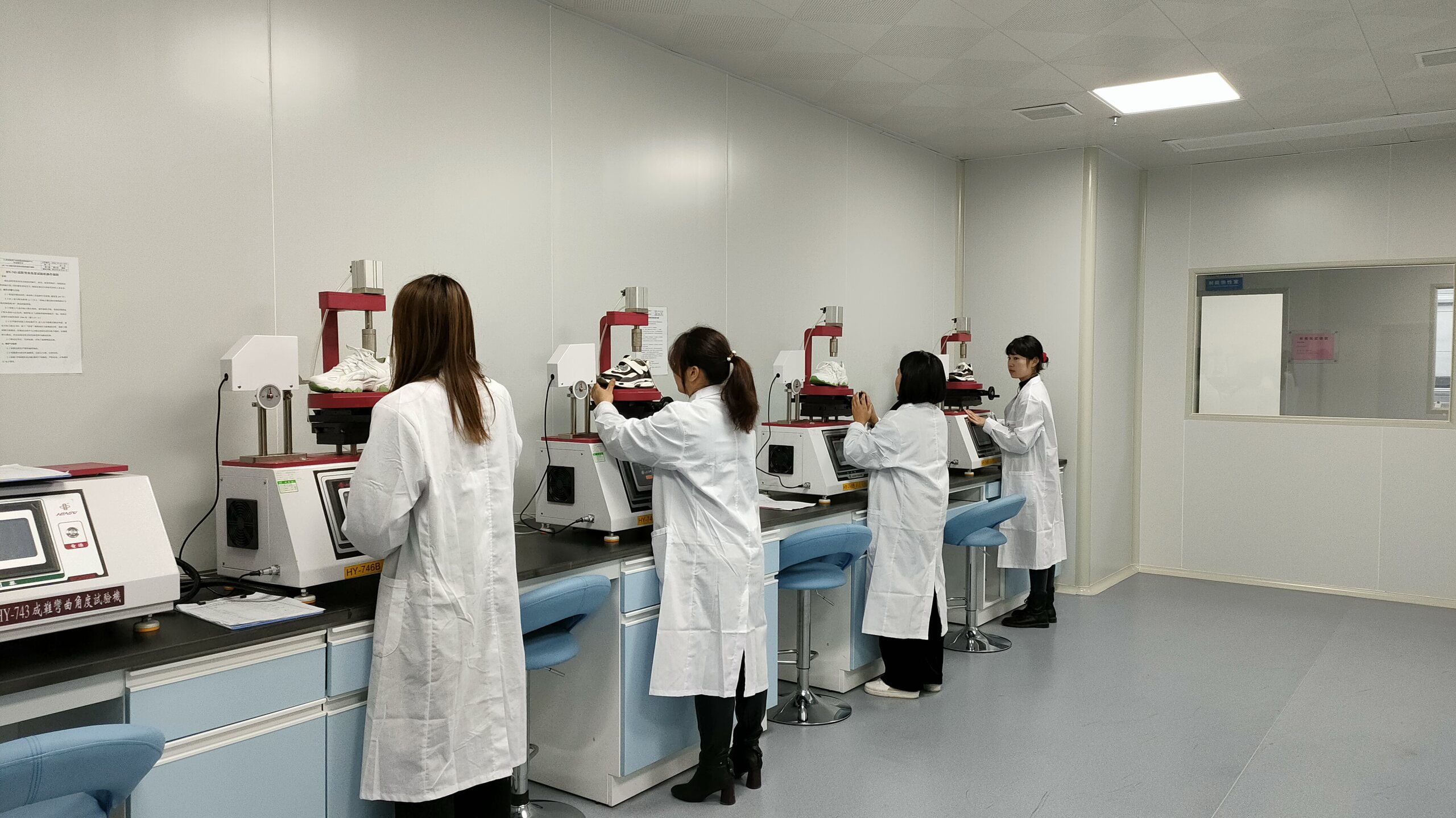Technicians running material and finished-goods tests in the in-house laboratory