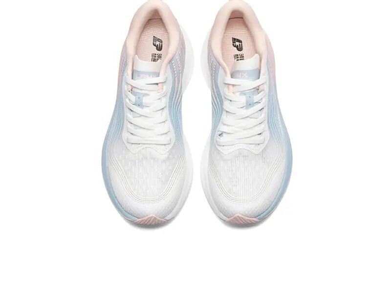 White and pink running shoes, top view